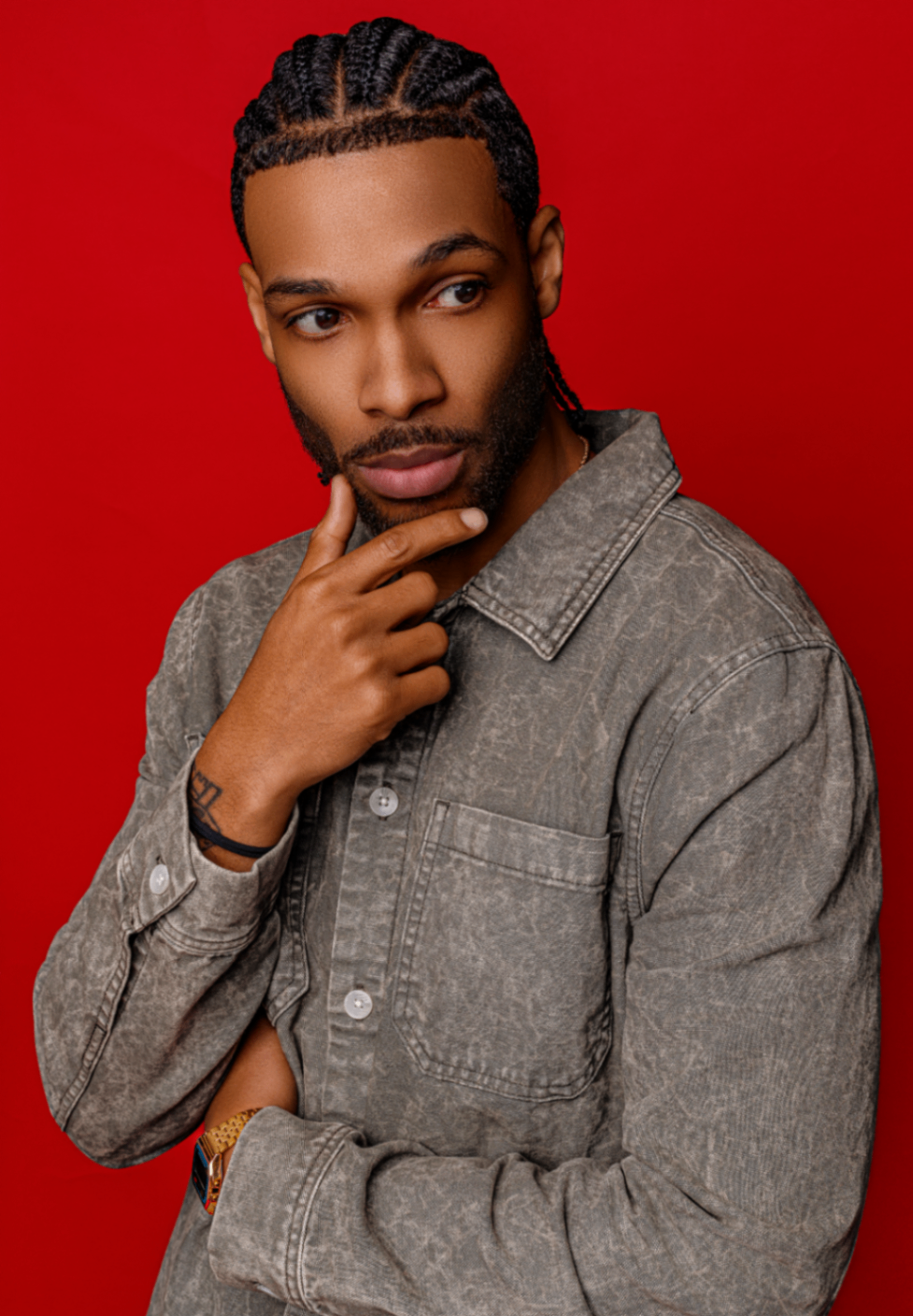 Studio portrait on bold red backdrop