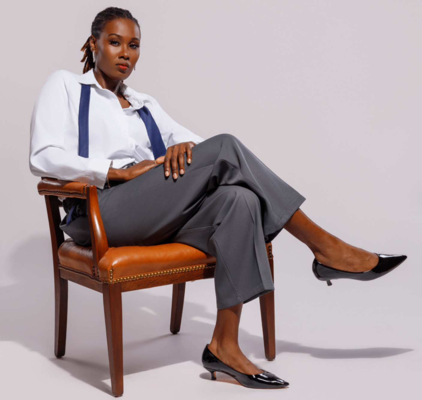 Editorial portrait, woman in studio chair
